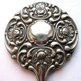 Art Nouveau hand-facing, mirror in repulsed silver frame, rose decoration 14x27cm