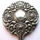 Face à main art nouveau miroir dans armature argent repoussé décor de roses 14x27cm