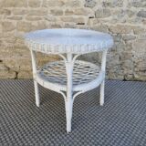 Round white rattan side table with storage underneath, circa 1970.