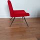 Vintage red faux fur armchair with black metal legs.