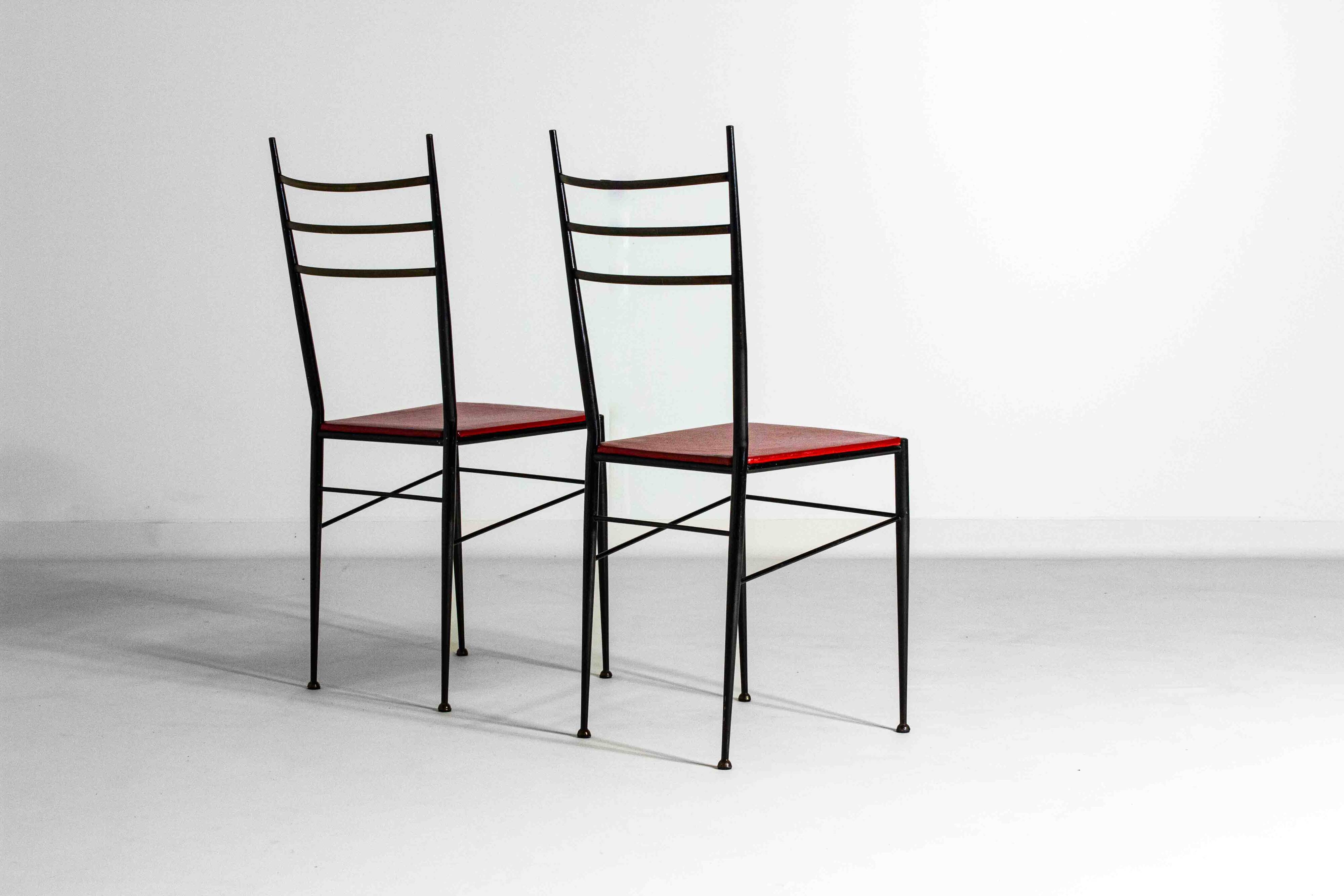 Fine set of metal dining chairs with red leather seating, Italy 1970s
