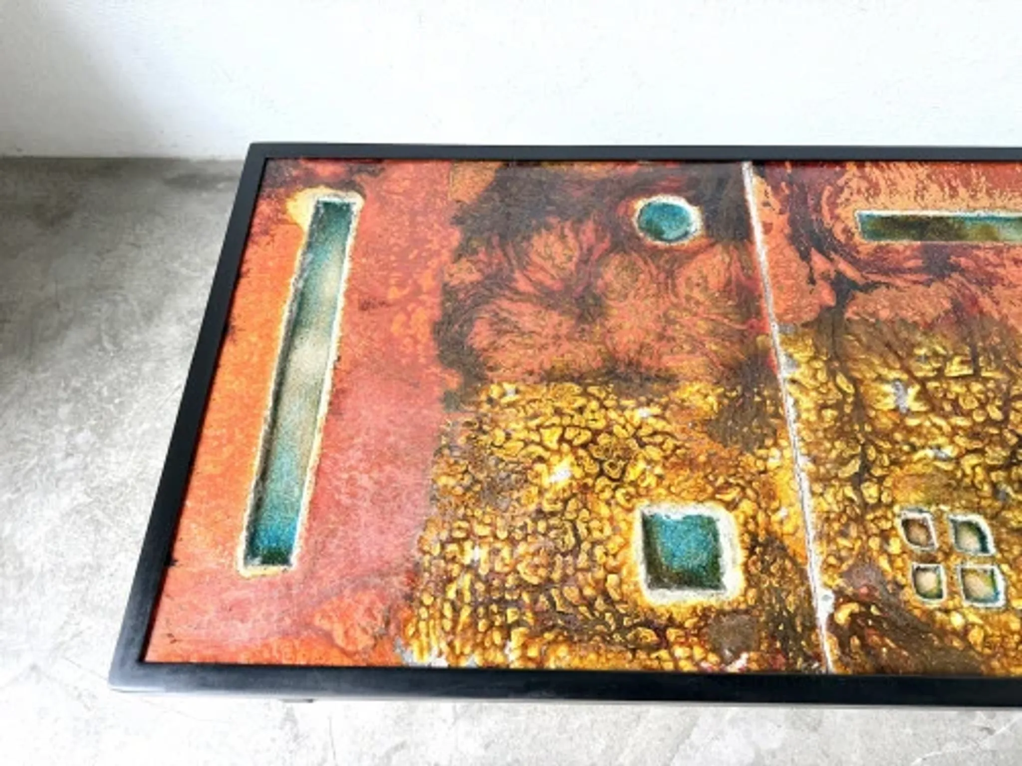 Coffee table by Robert and Jean Cloutier in enamelled lava and metal, 1950s.