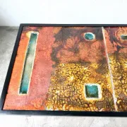 Coffee table by Robert and Jean Cloutier in enamelled lava and metal, 1950s.