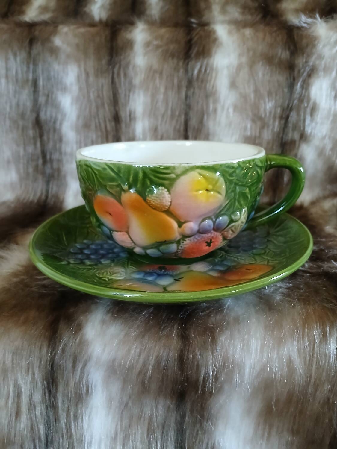 Antique cup and saucer in slipware.