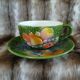 Antique cup and saucer in slipware.