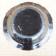Old large round black ceramic dish