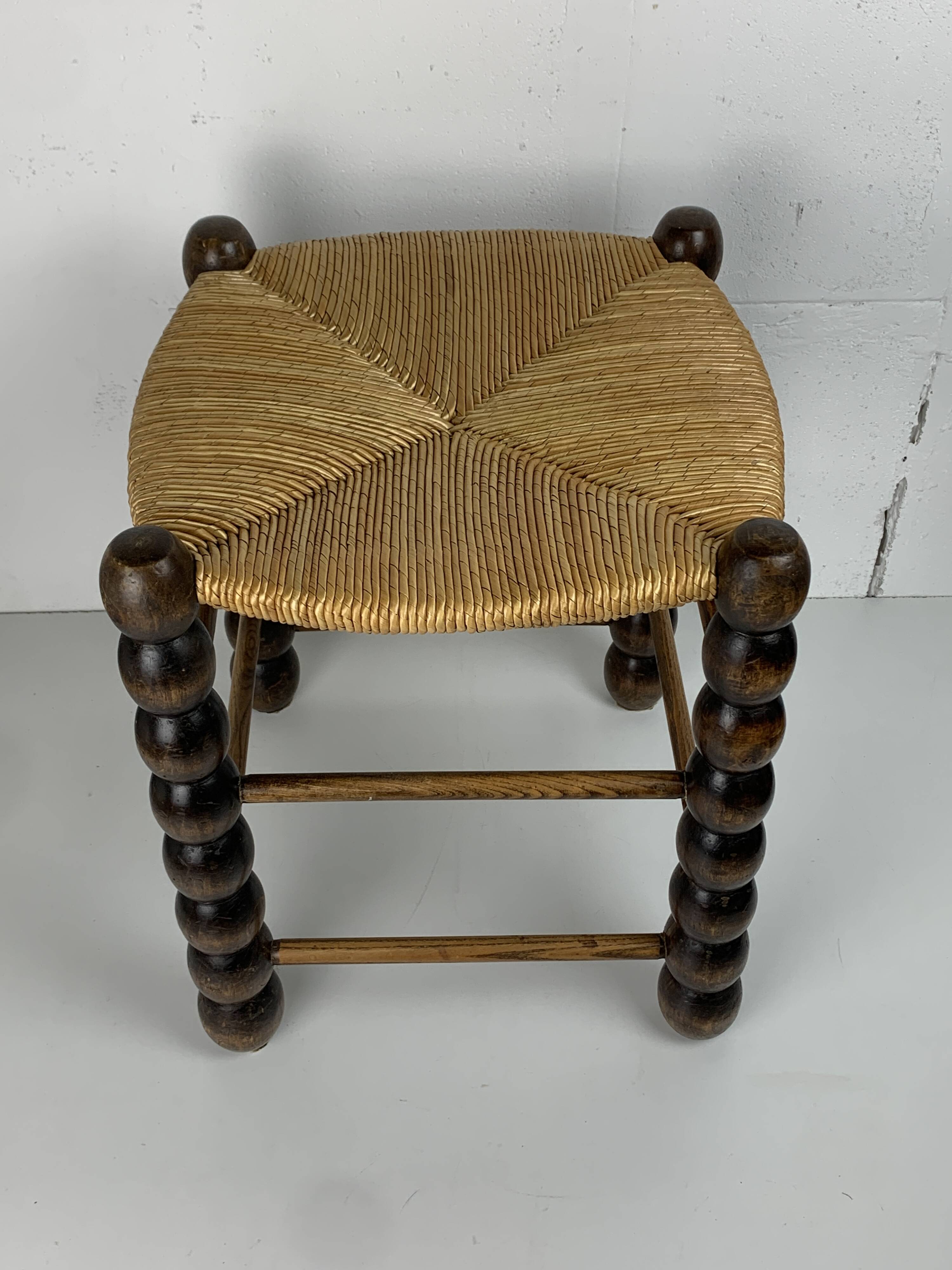 Brutalist wood turned bobbin rush stool in the style of Charles Dudouyt