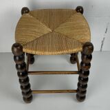 Brutalist wood turned bobbin rush stool in the style of Charles Dudouyt