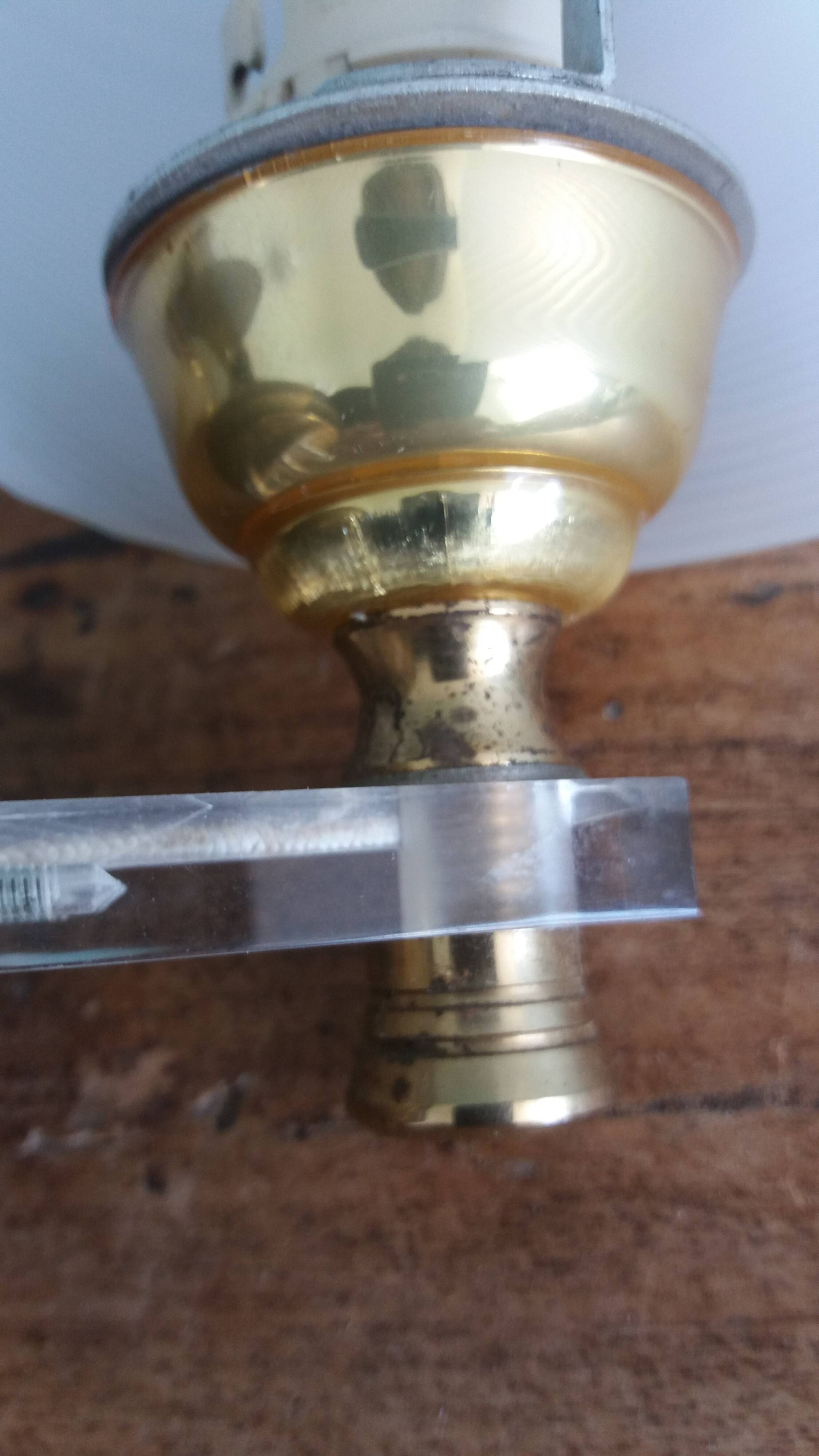 Golden metal appliques and plexiglass perspex in the style of Maison Lunel or Guariche.