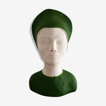 Bust of a woman in green and white plaster