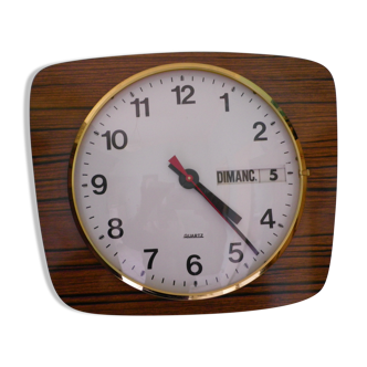 Formica wall clock with day and date - 1970s