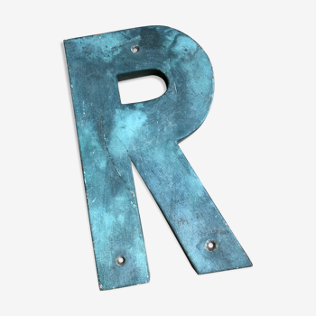 Ancient letter r sign metal painted