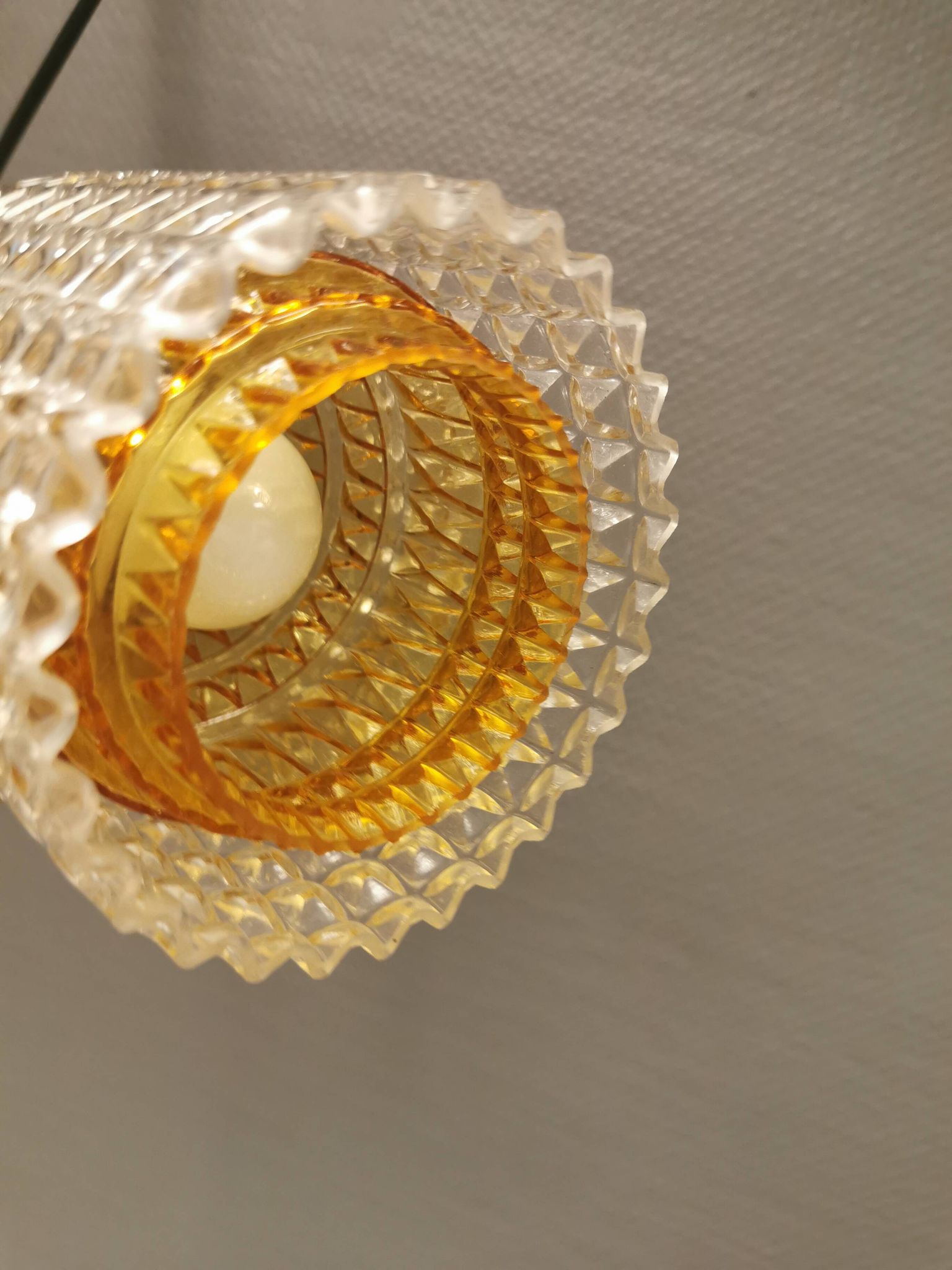 Older Swedish hanging lamp in multi-layered crystal glass with rosewood top and brass ring.