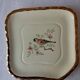 Trivet and bottle holder Salin, 1950s. Bird on branch.