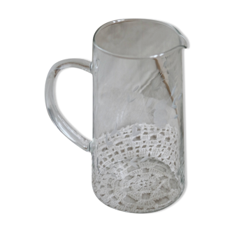 Large vintage engraved glass pitcher with floral pattern