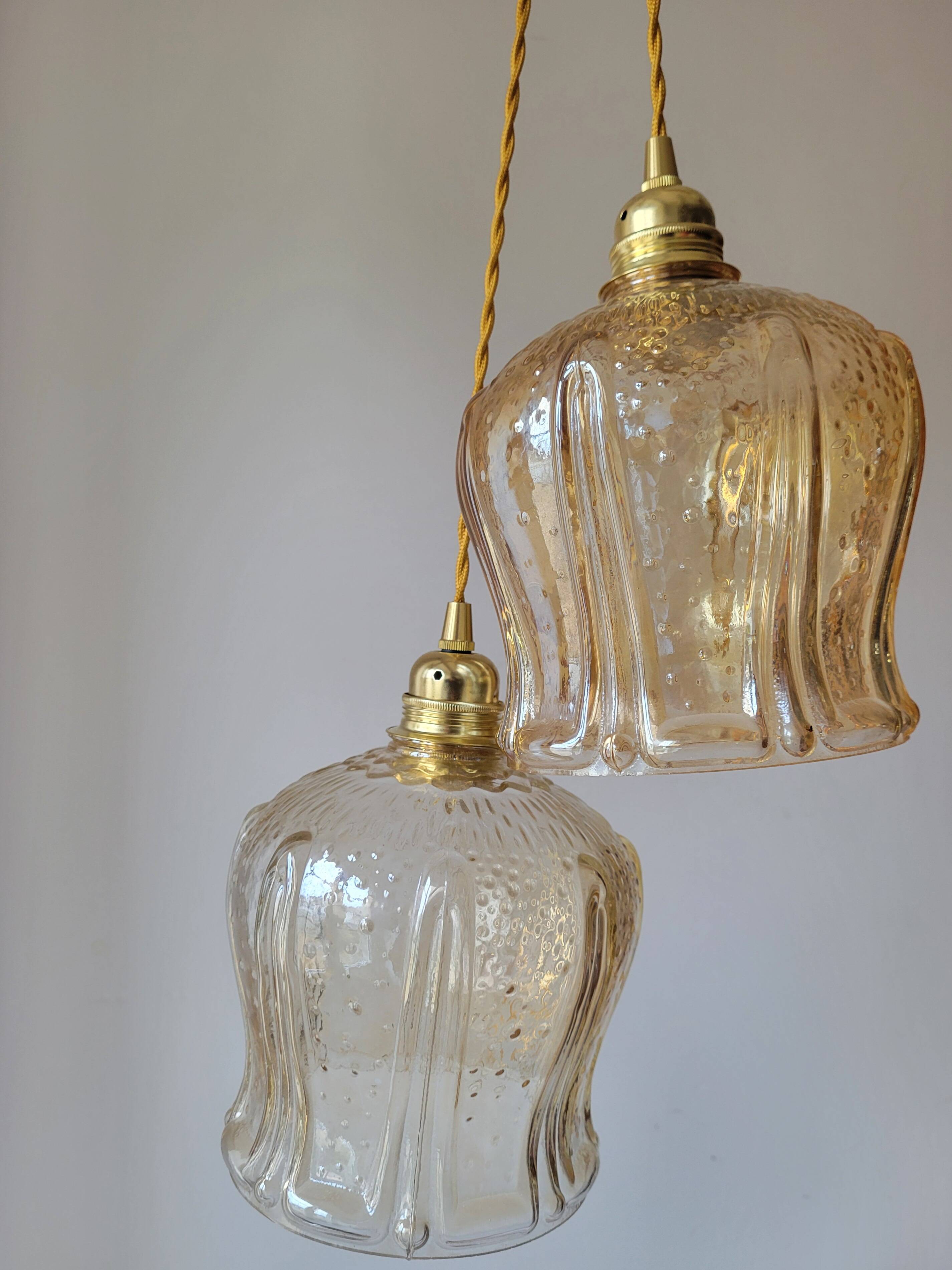 Trio of amber glass pendant lights