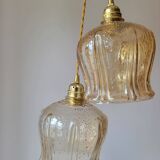 Trio of amber glass pendant lights