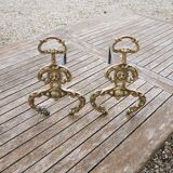 Antique brass andirons with lion decoration