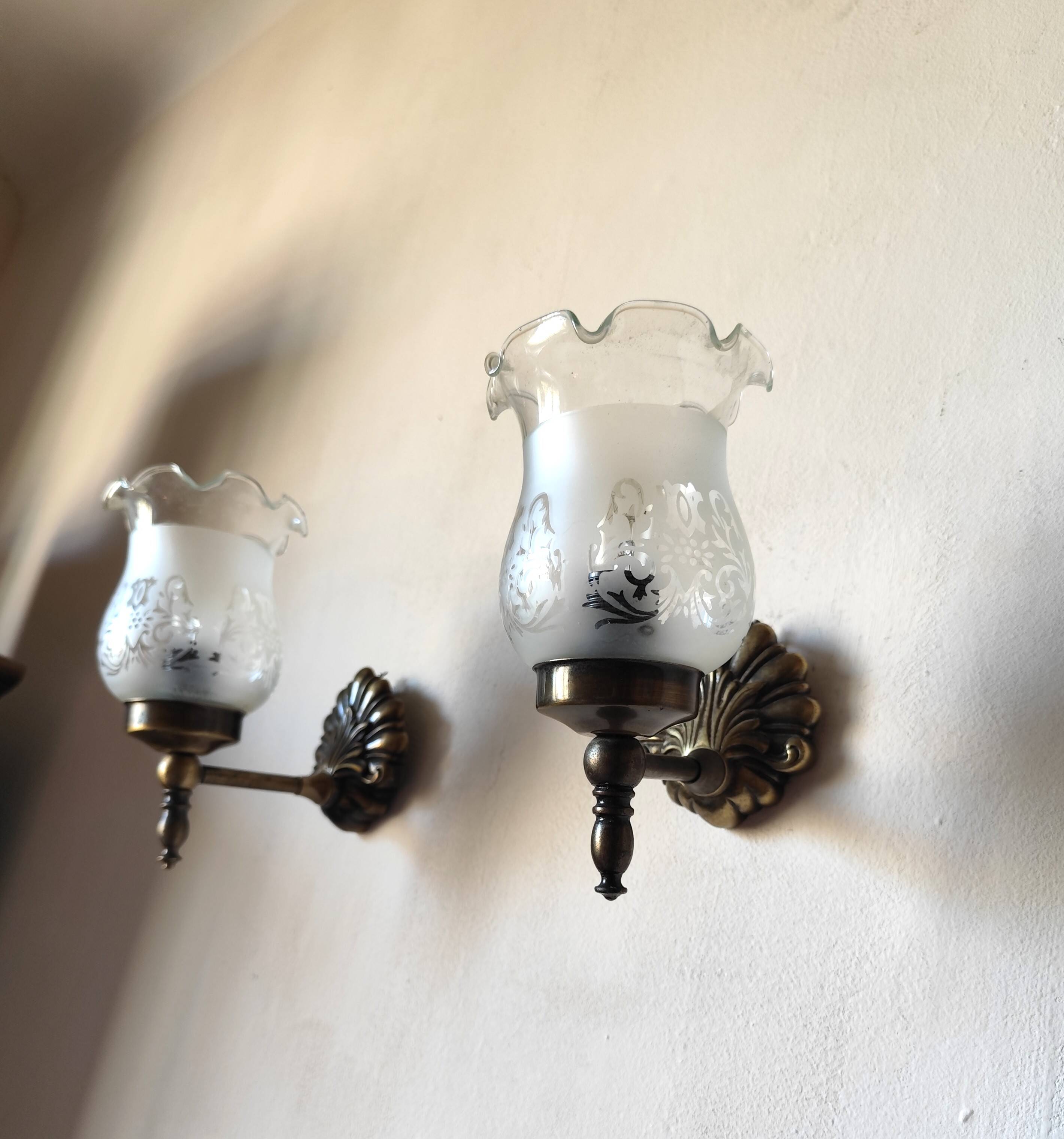 Pair of wall sconces in bronze with opaline glass tulips.