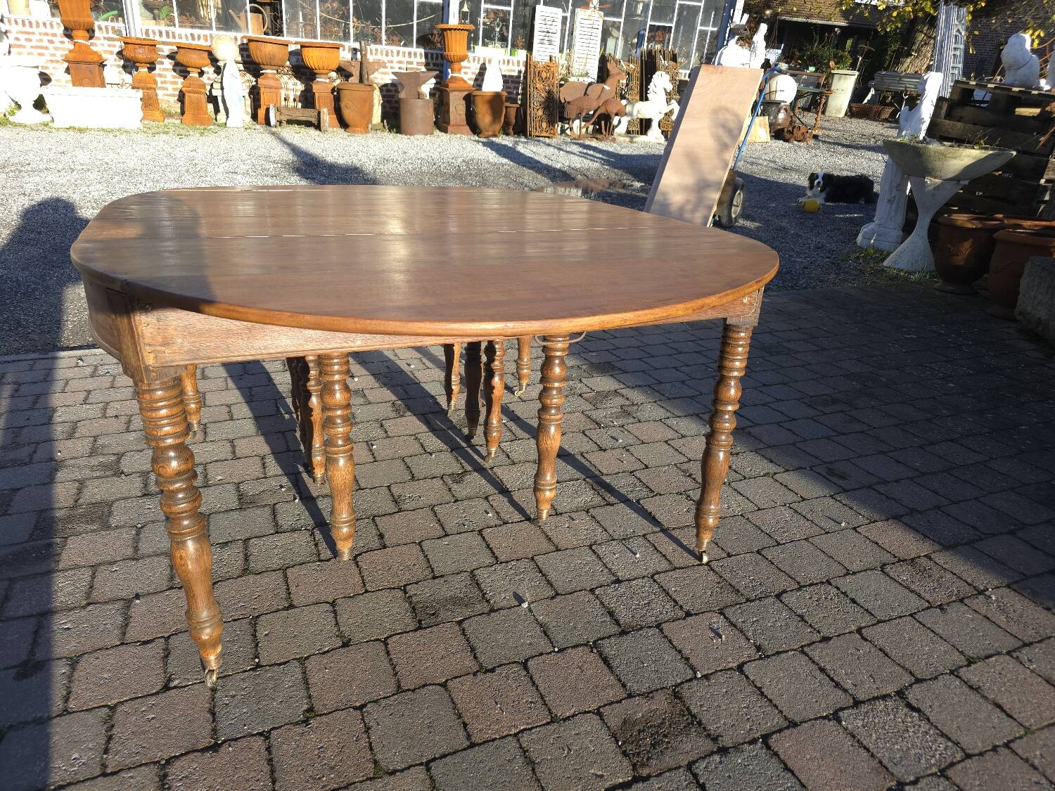 12-foot round oak table with 7 extensions / 20 people