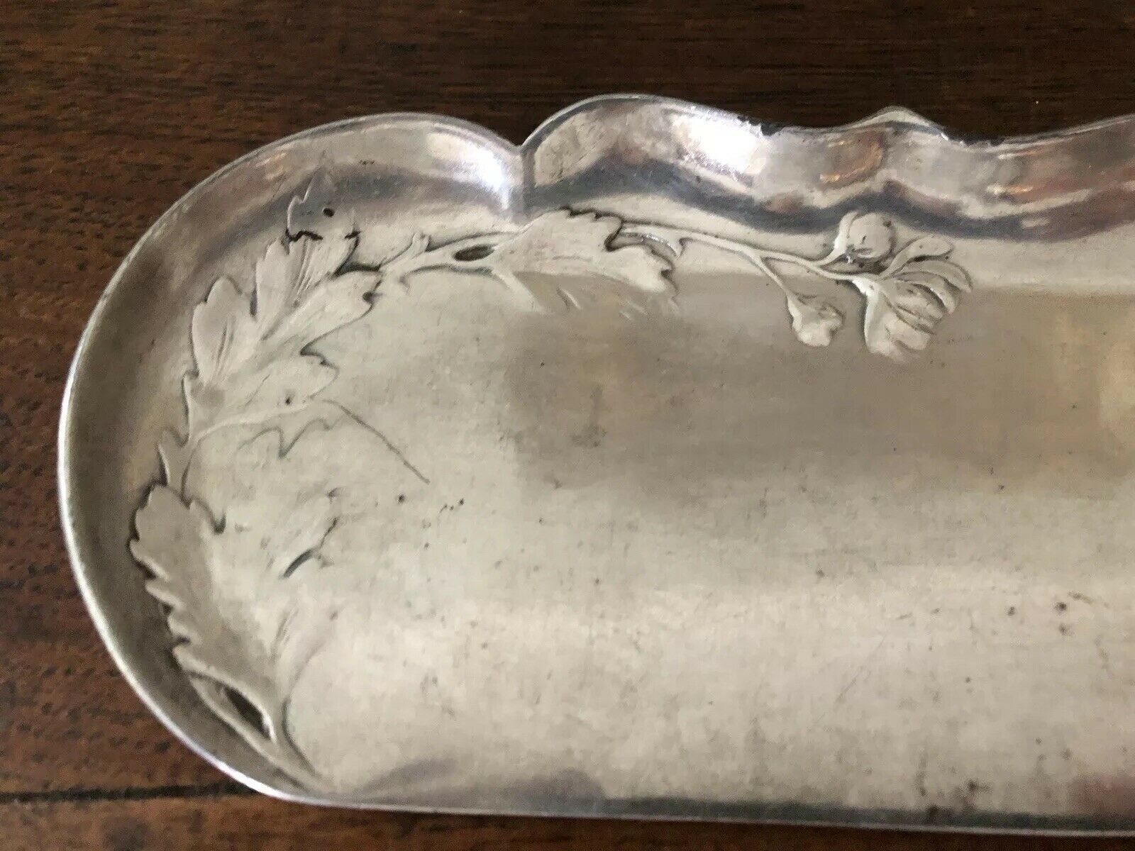 shovel picks up silver table crumbs