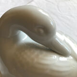Porcelain duck dish with lid on fire