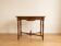 Antique walnut desk with a drawer and turned legs.