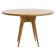 Round dining table in Wood Wood with brass details.