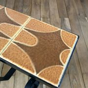 Magazine rack in ceramic and black, orange and brown iron from the 70s