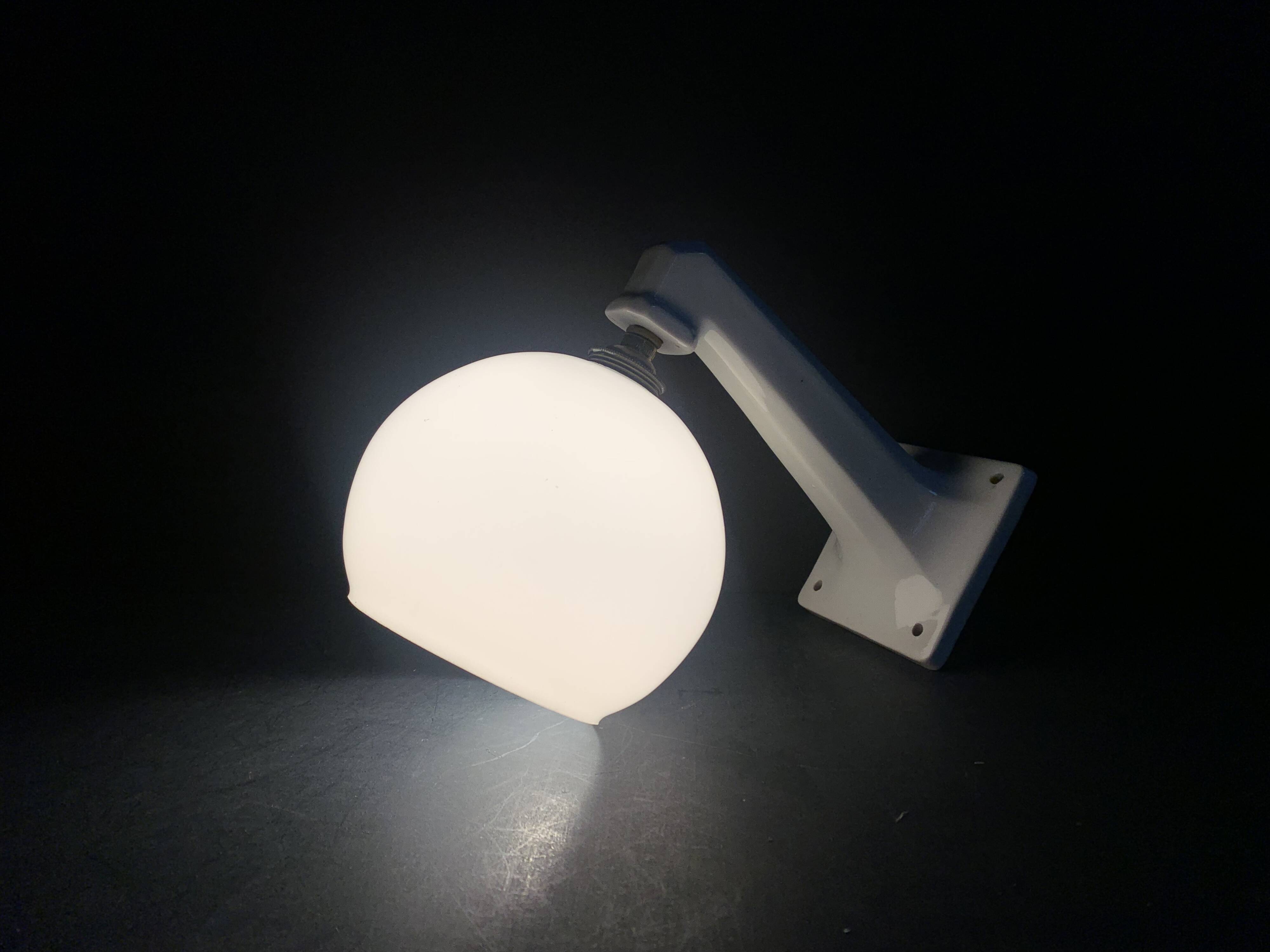 Pair of Art Deco porcelain wall lights with white Opaline globes, 1920