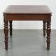Antique English writing desk from the 19th century with a red leather top
