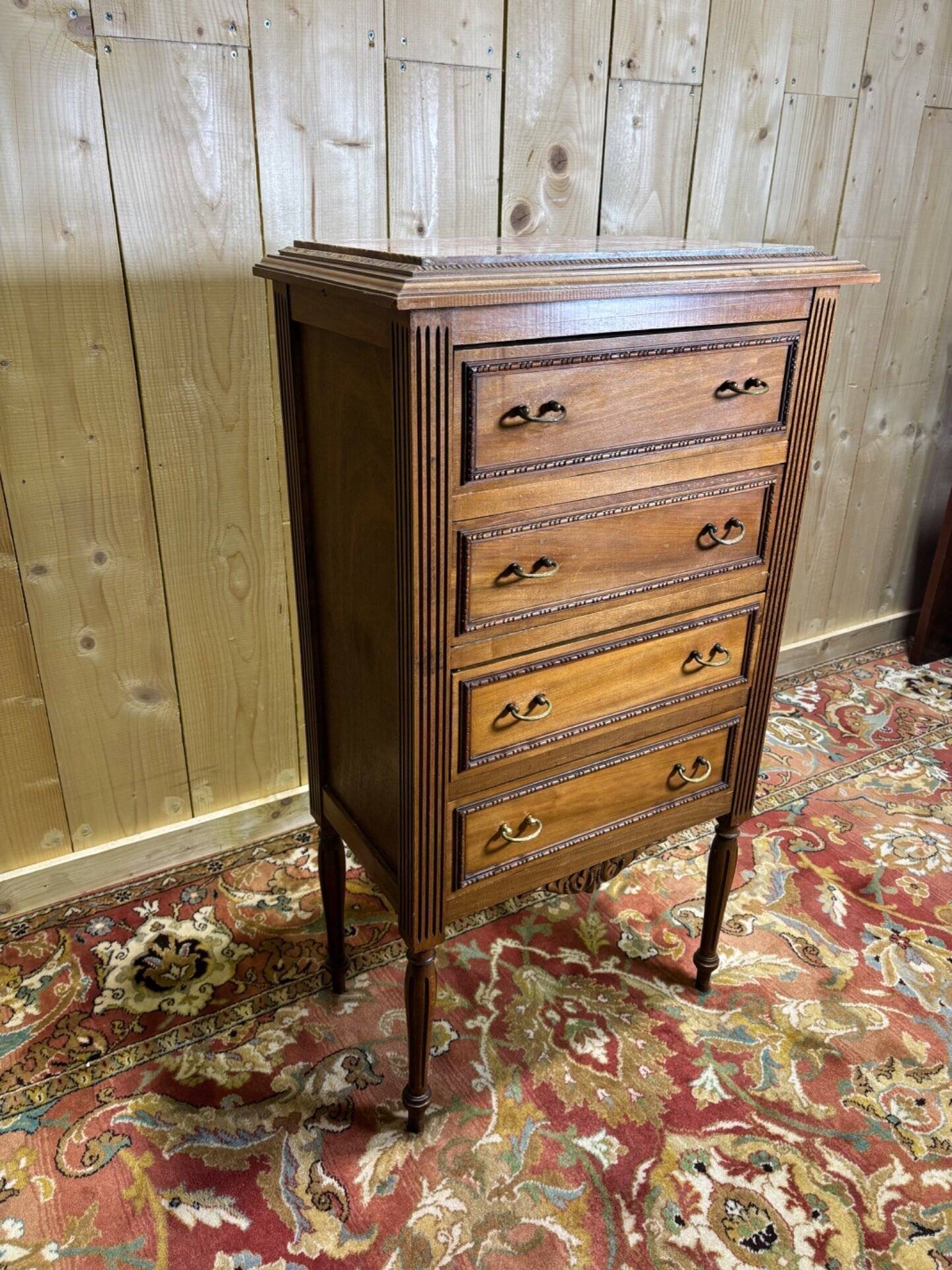 Louis XVI style molded and carved walnut chest of drawers