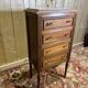 Louis XVI style molded and carved walnut chest of drawers