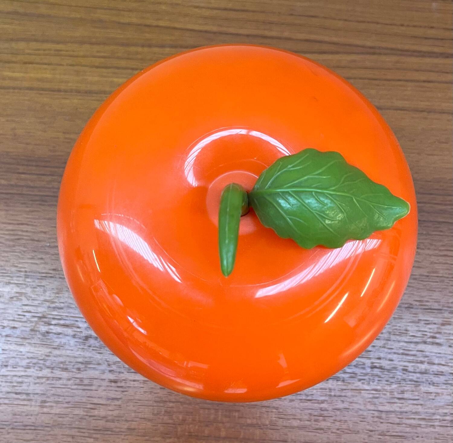 Orange plastic ice cube bucket from the 80s