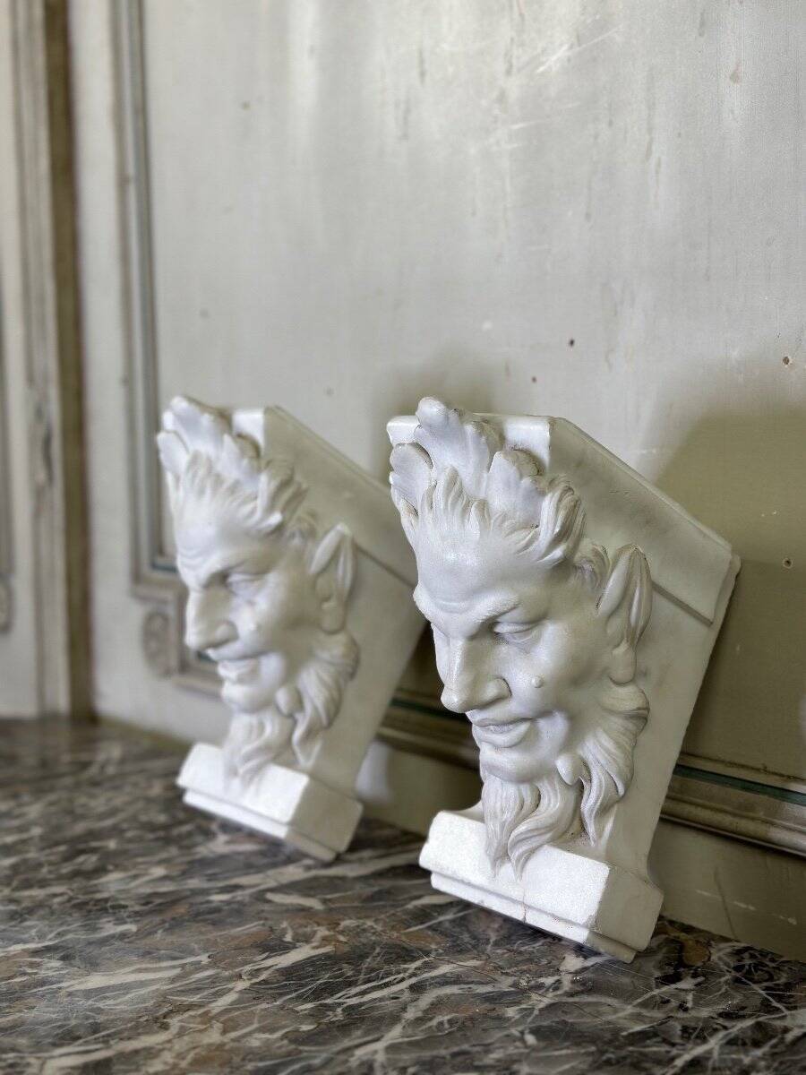 Pair of white statuary marble consoles, with faun heads