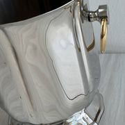 Champagne bucket in silver metal, gold handles, Guy Degrenne.