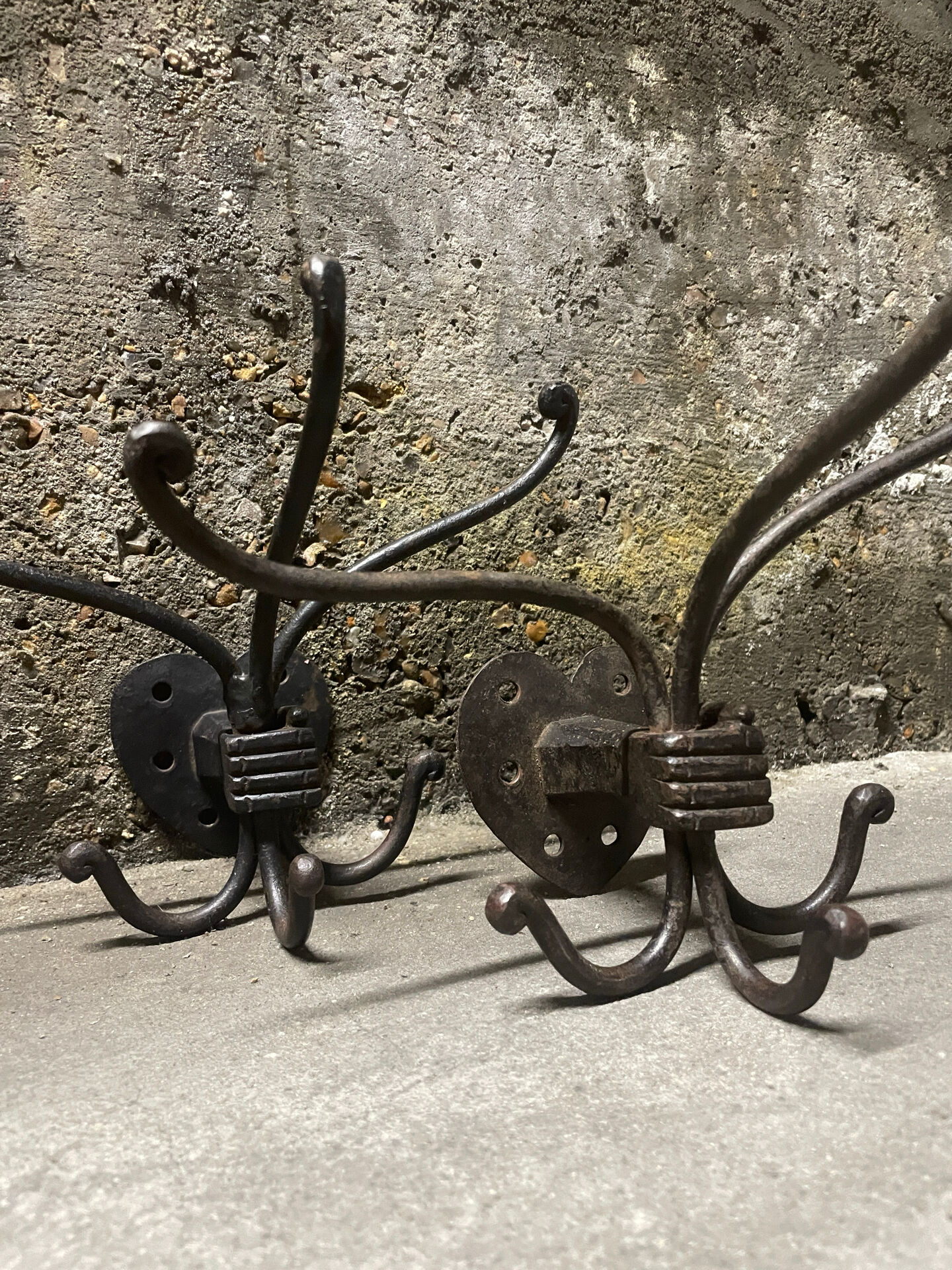 Brutalist pair of wall-mounted coat hooks.