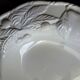Oval white vegetable dish, an antique tableware piece in barbotine earthenware.