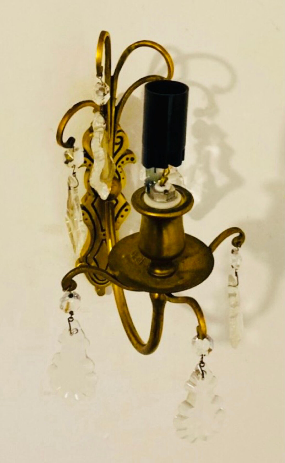 Brass wall light with glass pendants from the mid-20th century.
