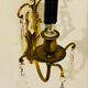 Brass wall light with glass pendants from the mid-20th century.