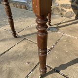 Round console table with folding shutters on copper wheels