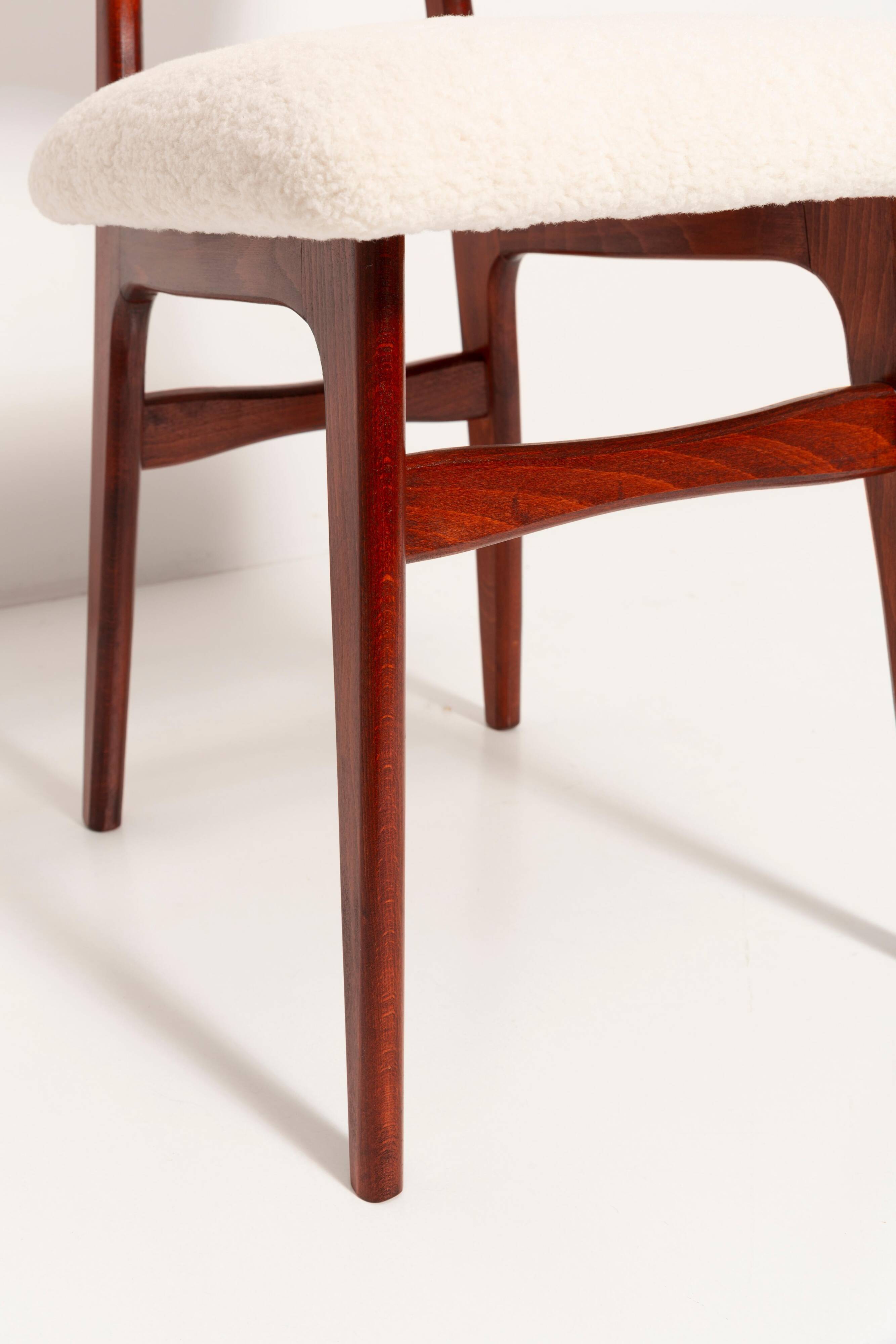 Beech wood armchair in cherry colour with cream boucle fabric - 20th century, Europe, 1960.