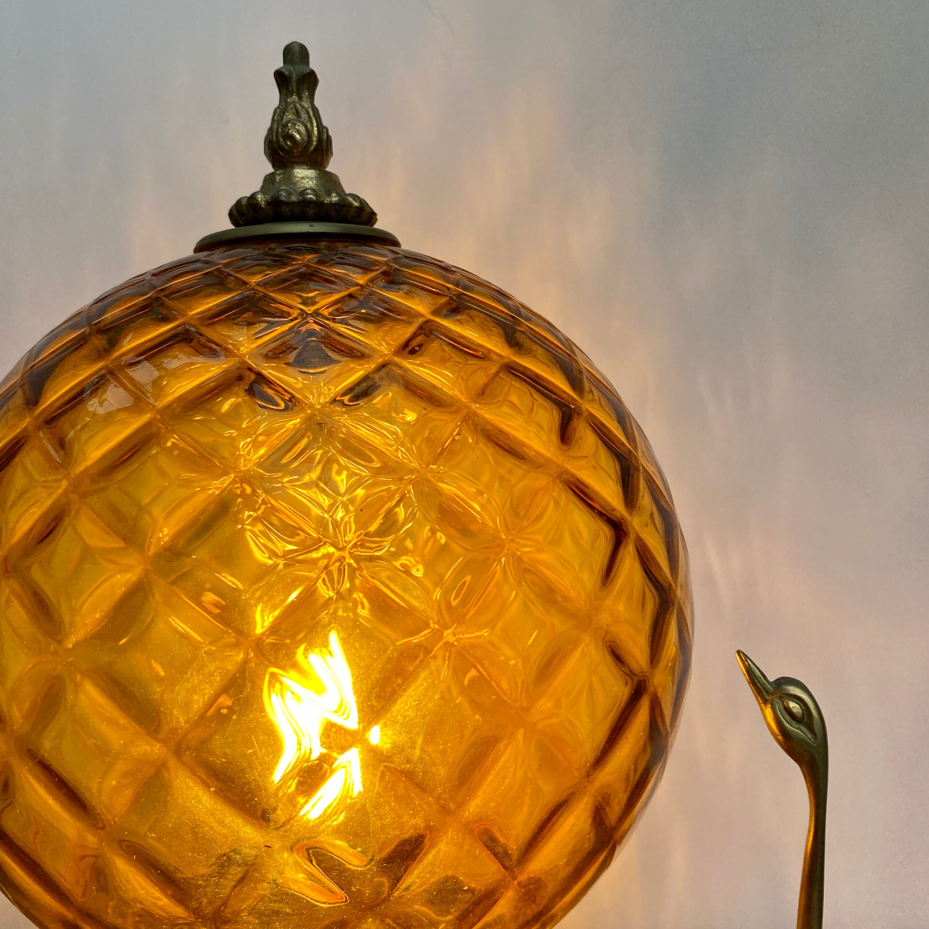 Vintage amber glass globe laying lamp with brass detail
