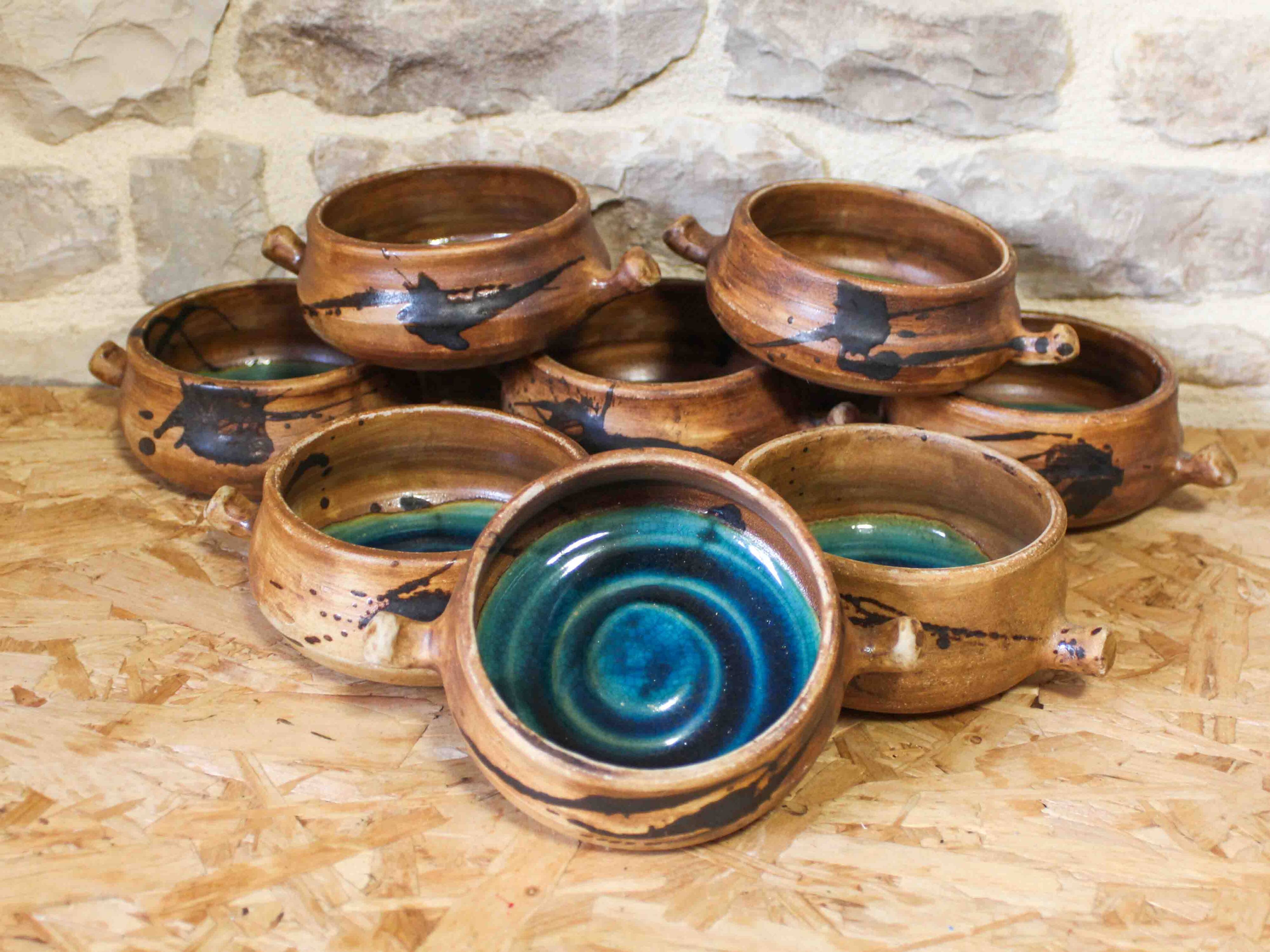 Set of 8 ceramic fondue pots from La Colombe pottery