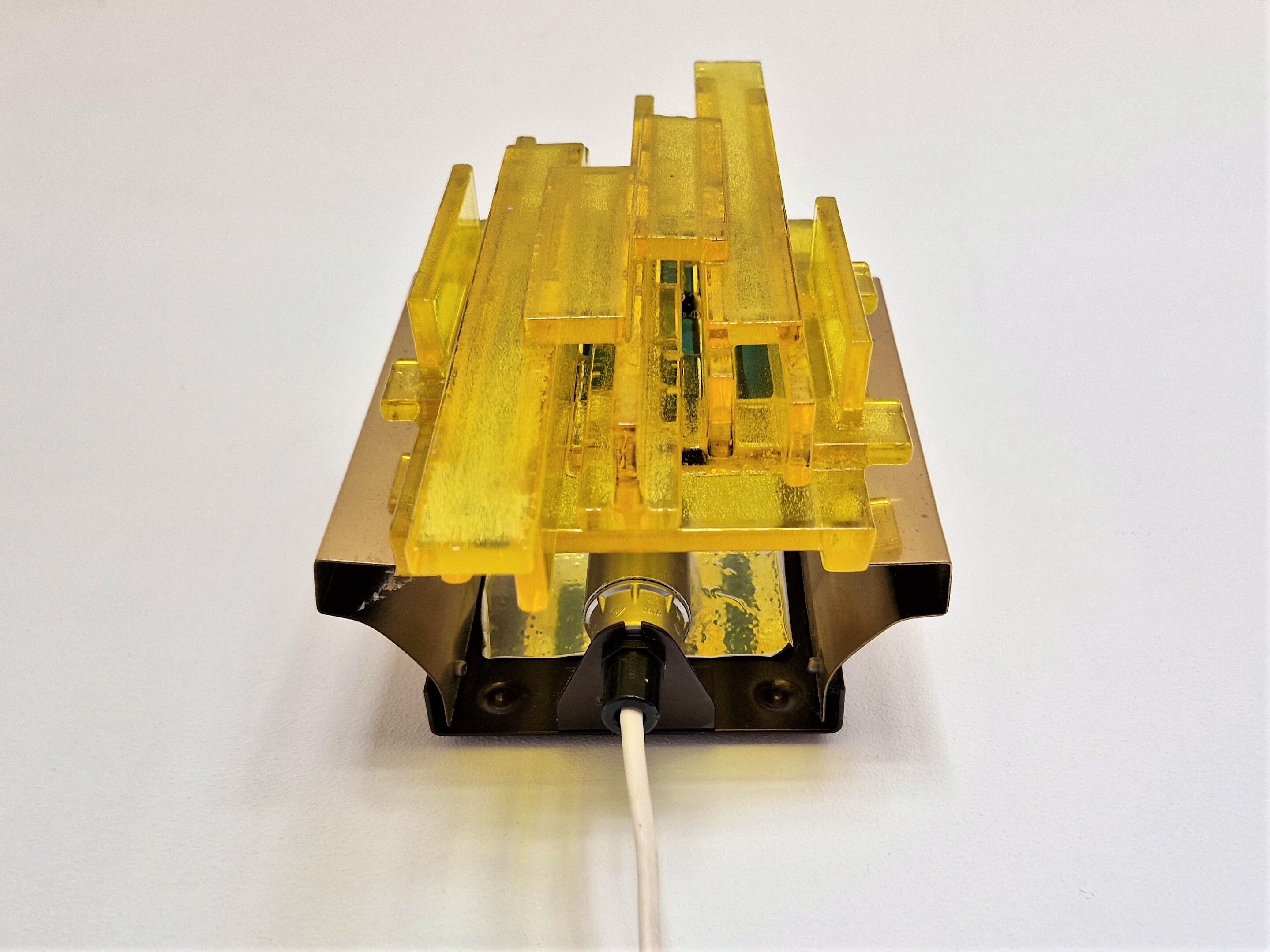 Yellow acrylic and metal wall lamp by Claus Bolby for Cebo Industri, Denmark 1960's