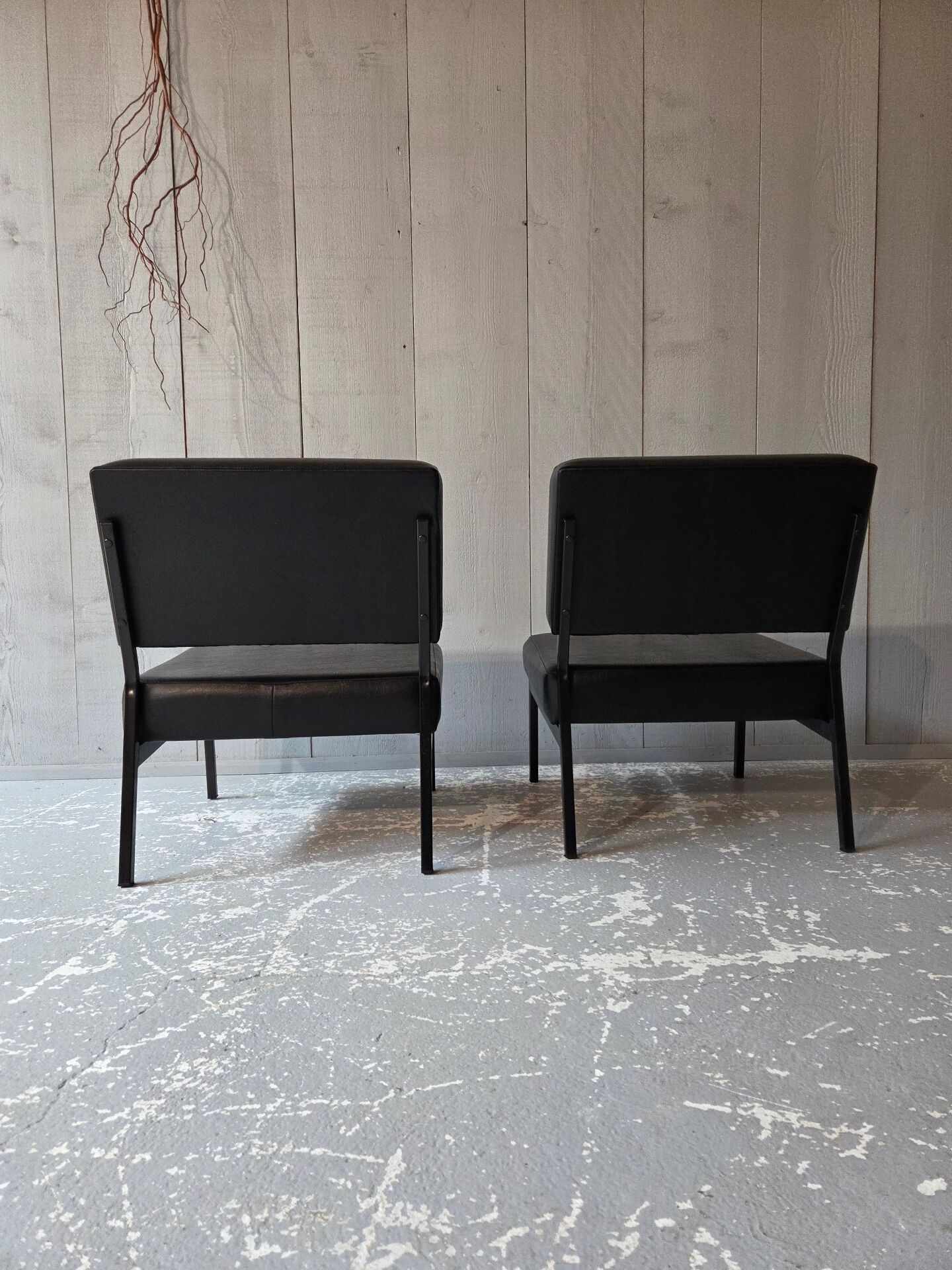 2 faux leather armchairs