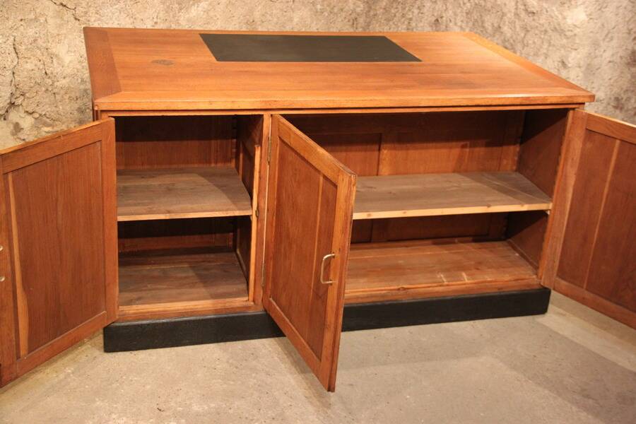 Double administrative desk with cupboard and drawer.