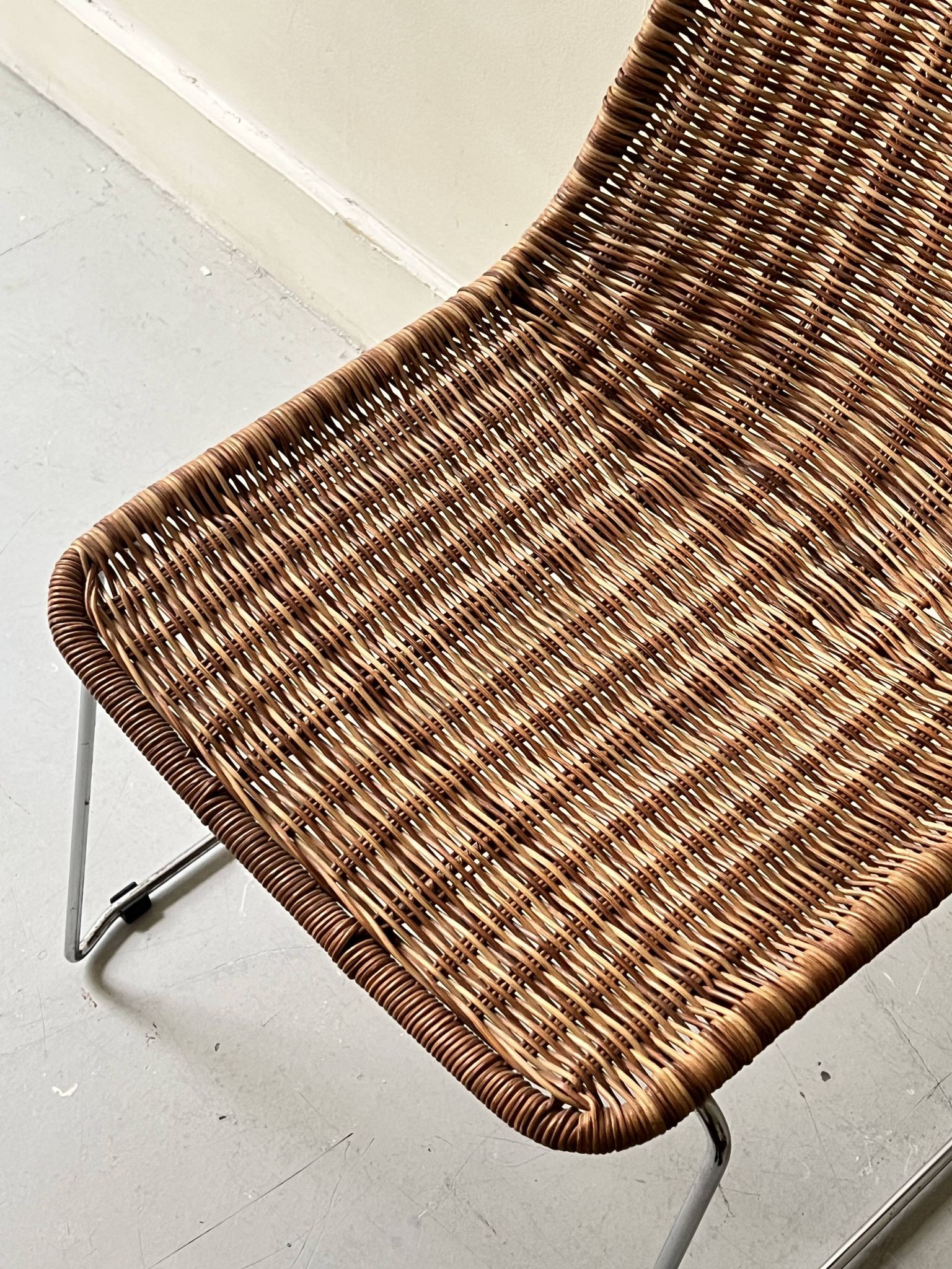 Chair made of rattan, wicker and chrome-plated metal