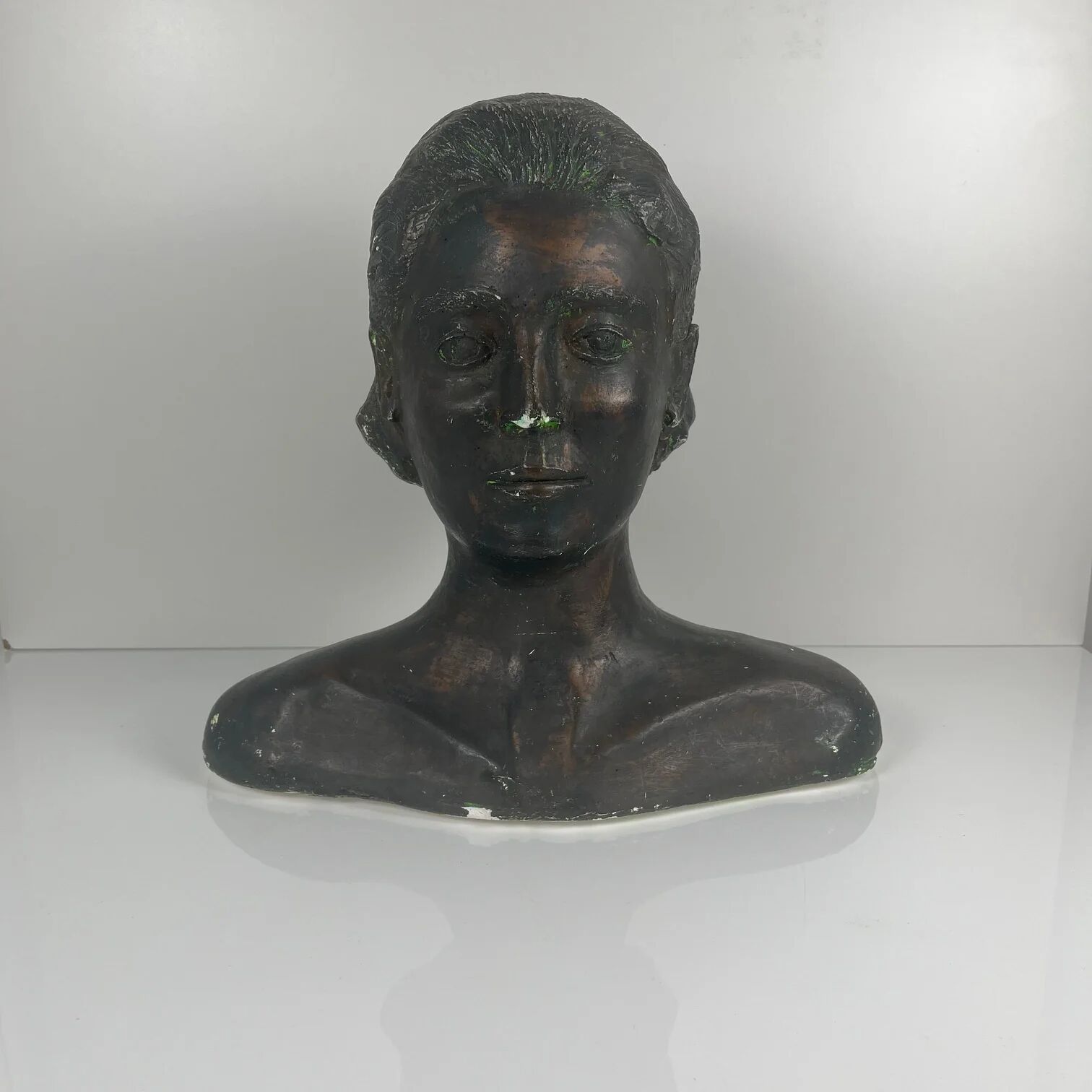 Female bust in neoclassical style in plaster by M. Mongey, 20th century.