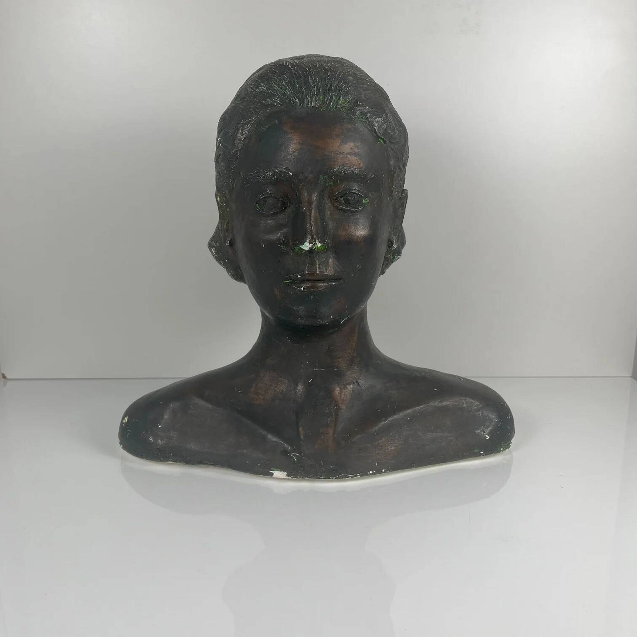 Female bust in neoclassical style in plaster by M. Mongey, 20th century.